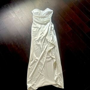 Strapless satin like white ruffle dress with slit in the front